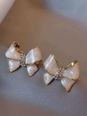 Elegant Bow Stud Earrings in Pearl White with Gold Trim